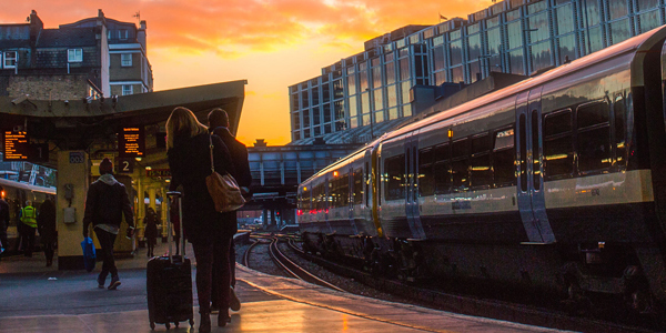 Train at station platform at sunset