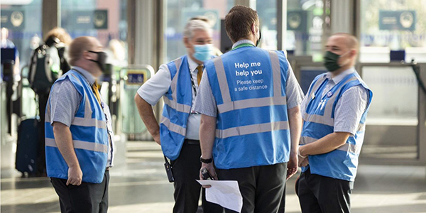 Covid rail staff on location team discussion