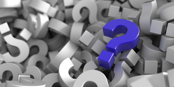 purple question mark in a pile of grey question marks
