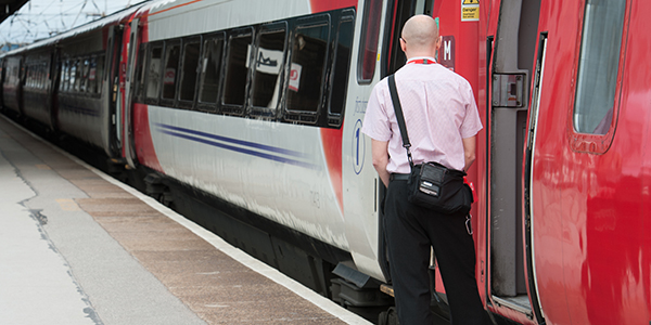 Train guard monitoring passenger safety at the Platform Train Interface