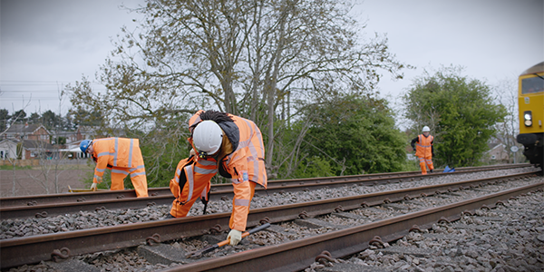 Red 71 Workmen in PPE on track