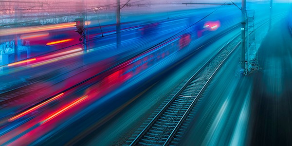 Blurred train speeding through a platform