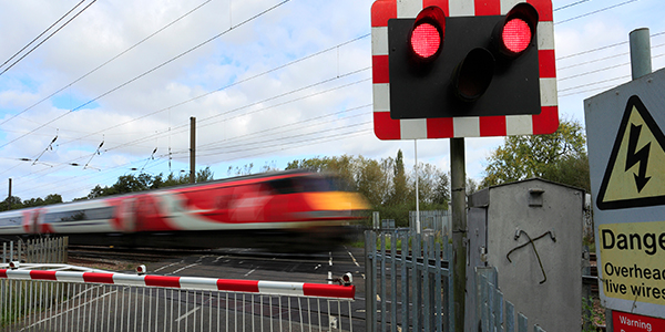 track-record-promo-600x300-train-passing-through-level-crossing