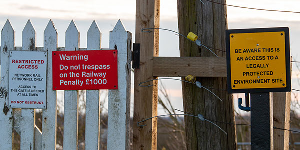 Trespass image of signs on railway